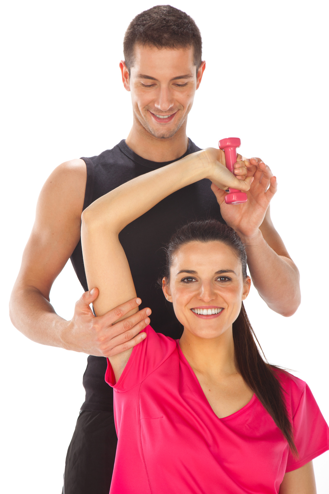 Woman with her personal fitness trainer exercising with weights